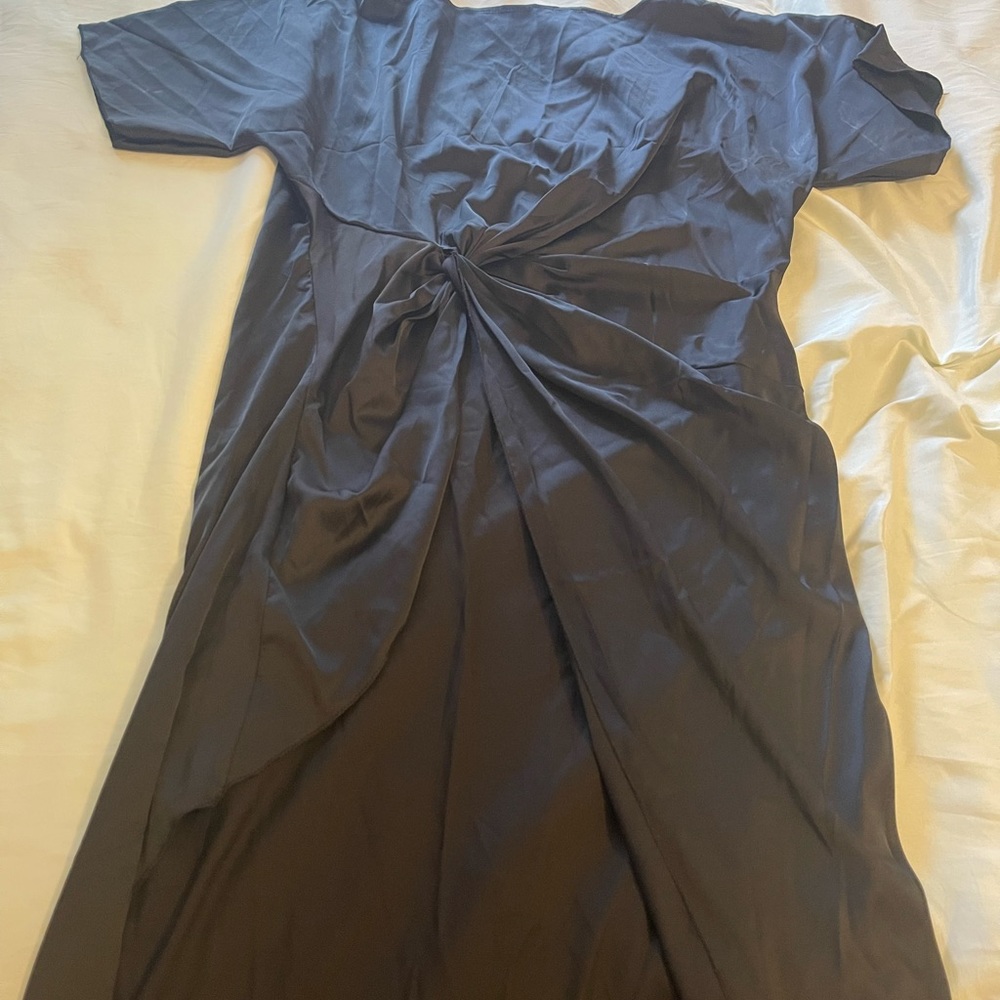 Black airy short sleeve knot dress with high slit. Never been worn